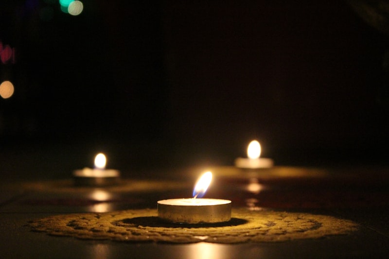Olive green candle with moss and stone notes
